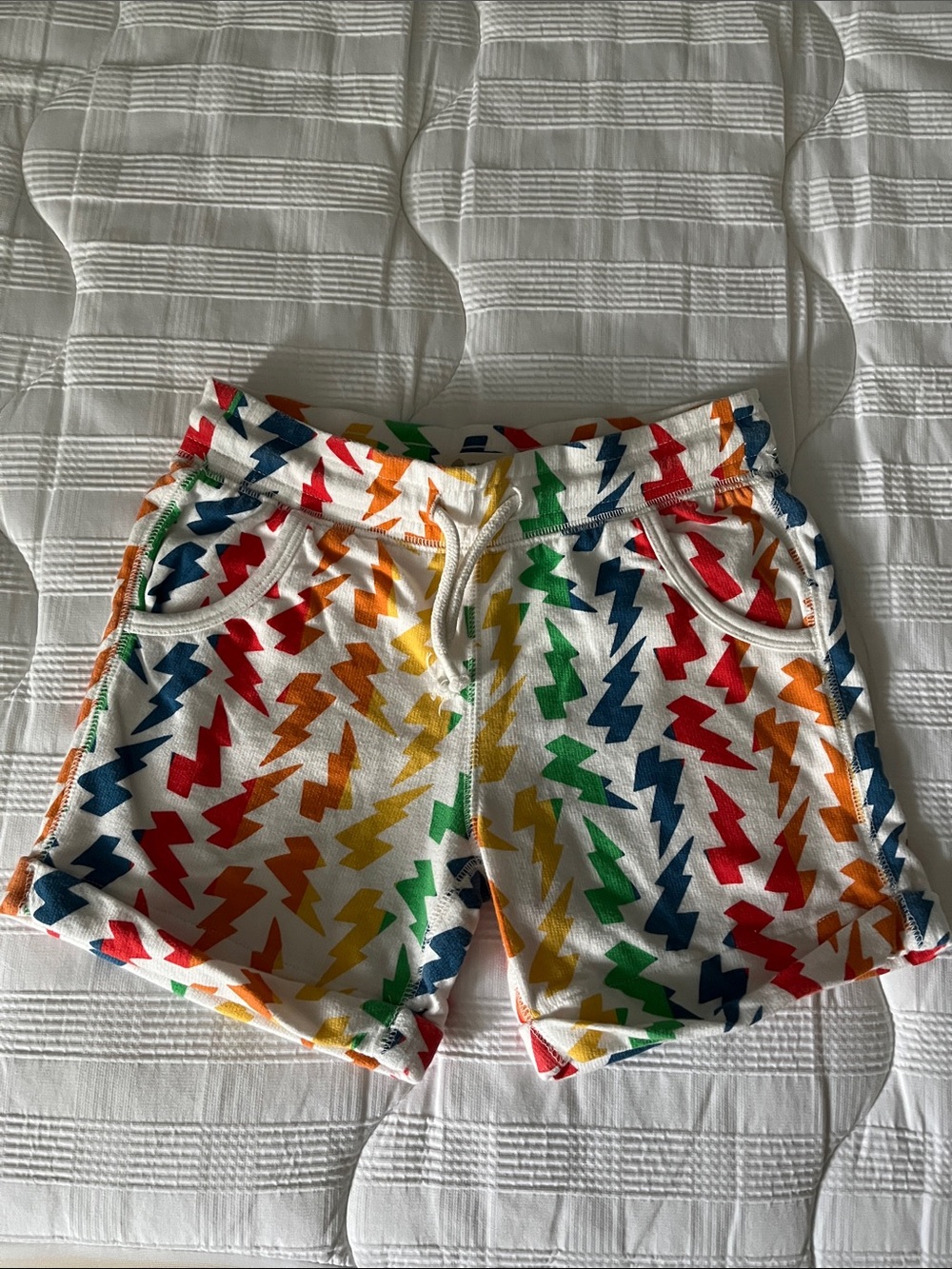 Never worn Toddler Tucker + Tate Rainbow Lightning Print shorts